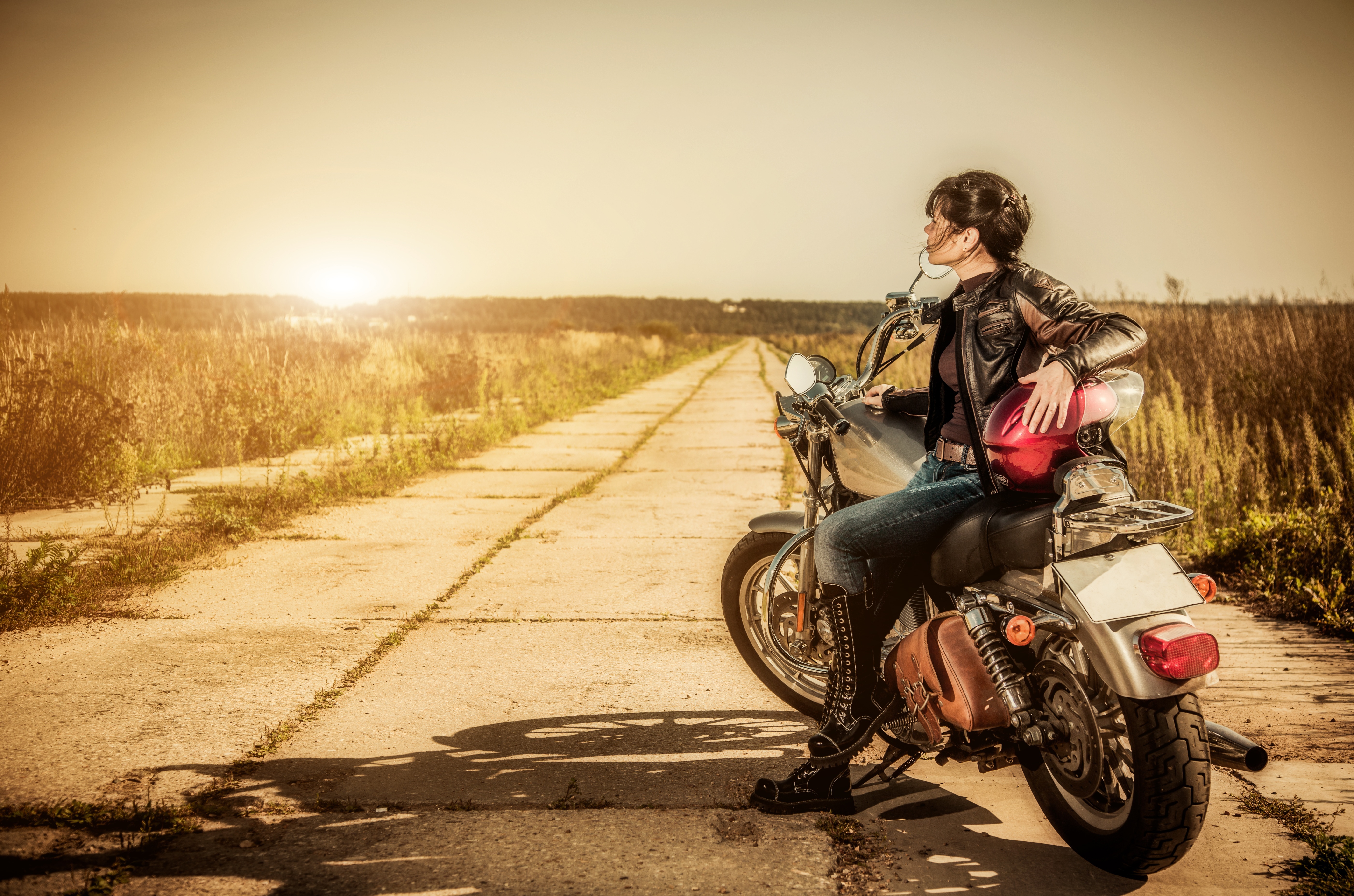 15831858 - biker girl sits on a motorcycle